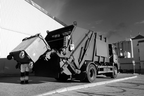 Frontline worker handling business waste in Greenwich, symbolising commitment to ethical practices.